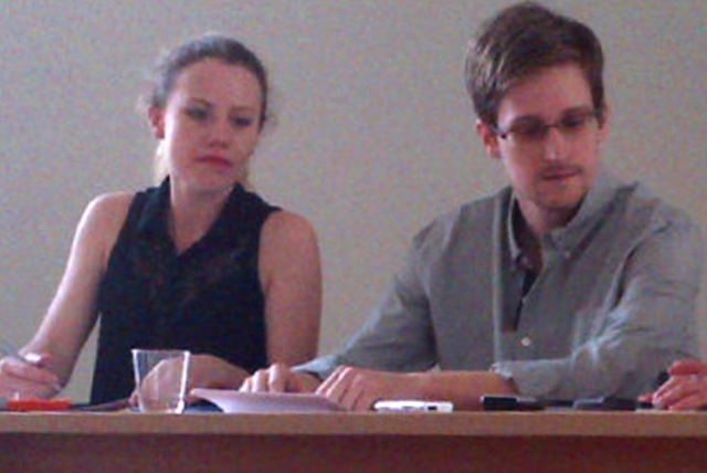 Picture released by Human Rights Watch shows US National Security Agency (NSA) fugitive leaker Edward Snowden (C) during a meeting with rights activists, with among them Sarah Harrison of WikiLeaks (L), at Moscow’s Sheremetyevo airport, on July 12, 2013.  Fugitive US intelligence leaker Edward Snowden on Friday told a group of activists that he wanted to claim asylum in Russia because he is unable to fly on anywhere else.